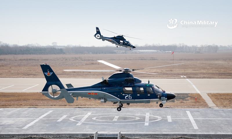 A ship-borne helicopter attached to a regiment under the PLA Naval Aviation University practice lift-off and landing on platform during a flight training course on February 20, 2021. Photo: China Military Online