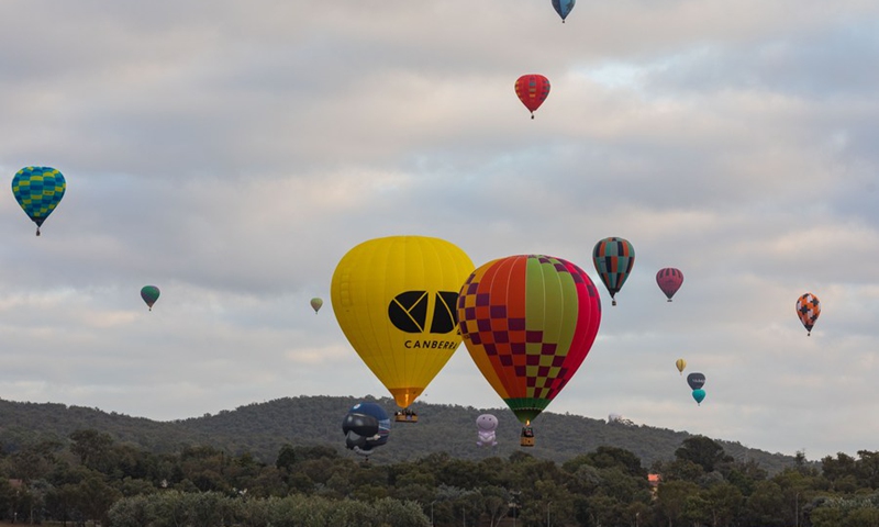 Hot air balloons are seen in the sky during the annual Canberra Balloon Spectacular festival in Canberra, Australia, March 6, 2021.(Photo: Xinhua)