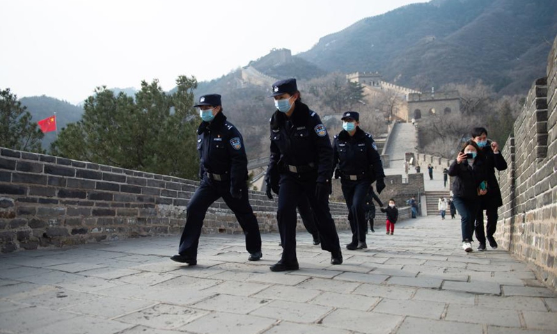 Members of the female police force of Badaling Police Station patrol on the Badaling Great Wall in Beijing, capital of China, March 7, 2021. (Photo: Xinhua)