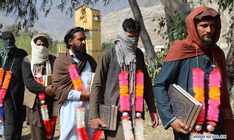 Militants attend a surrender ceremony in Asadabad, capital of Kunar province, Afghanistan, March 10, 2021. Twenty-five militants on Wednesday surrendered to the government authorities in Afghanistan's eastern Kunar province, the province governor said.(Photo: Xinhua)