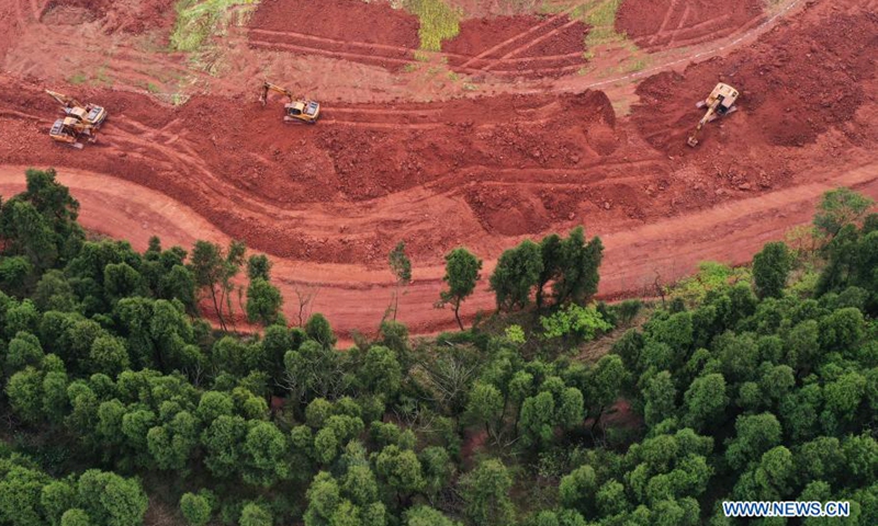 Aerial photo shows excavators working in fields in Shuangjiang Town in Tongnan District of southwest China's Chongqing, March 10, 2021.(Photo:Xinhua) 