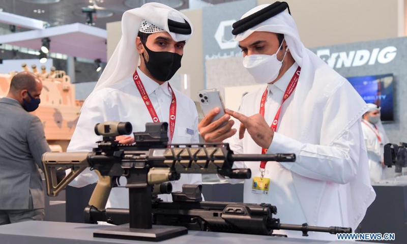 Visitors look at exhibits after the opening ceremony of Milipol Qatar 2021, an international event for homeland security and civil defense, in Doha, Qatar, on March 15, 2021. The exhibition which kicked off on Monday will last until March 17.(Photo: Xinhua)