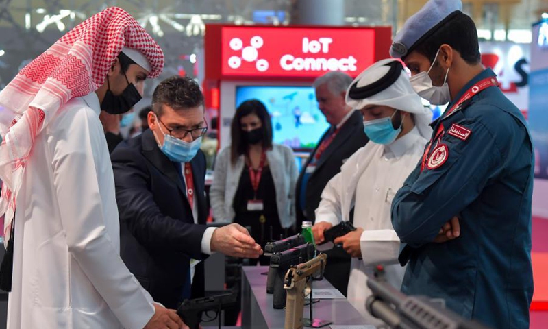 Visitors look at exhibits after the opening ceremony of Milipol Qatar 2021, an international event for homeland security and civil defense, in Doha, Qatar, on March 15, 2021. The exhibition which kicked off on Monday will last until March 17.(Photo: Xinhua)