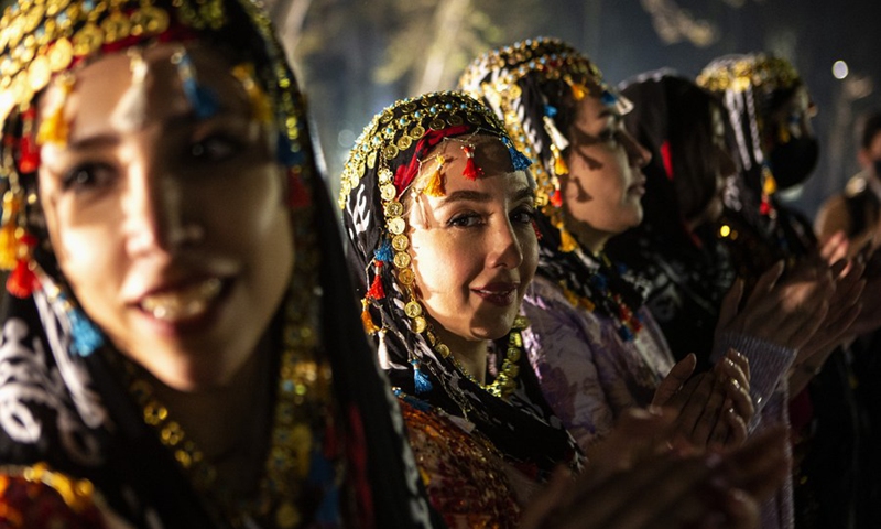 Iranian women dressed in traditional costumes celebrate the upcoming Iranian new year in a street in Tehran, Iran, on March 15, 2021.(Photo: Xinhua)