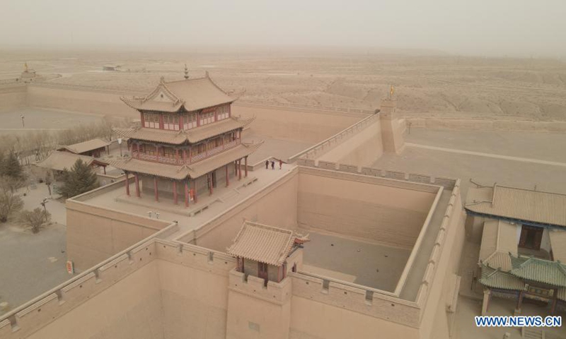 Aerial photo taken on March 17, 2021 shows the Jiayu Pass shrouded in dust in Jiayuguan City, northwest China's Gansu Province. Some areas in Hexi Corridor, part of the ancient Silk Road in China's northwest, were covered by floating sand and dust on Wednesday.(Photo: Xinhua)