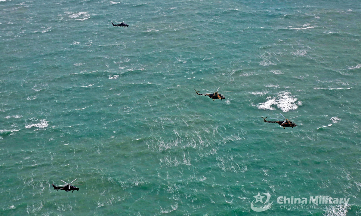 Helicopters attached to an army aviation brigade under the PLA 72th Group Army fly in close formation during a joint training exercise with a unit of PLA Navy on January 28, 2021. Photo:China Military Online