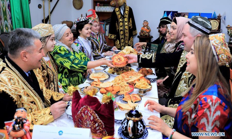 People get together and eat traditional food to celebrate Nauryz festival in Nur Sultan, Kazakhstan, March 19, 2021.(Photo: Xinhua)