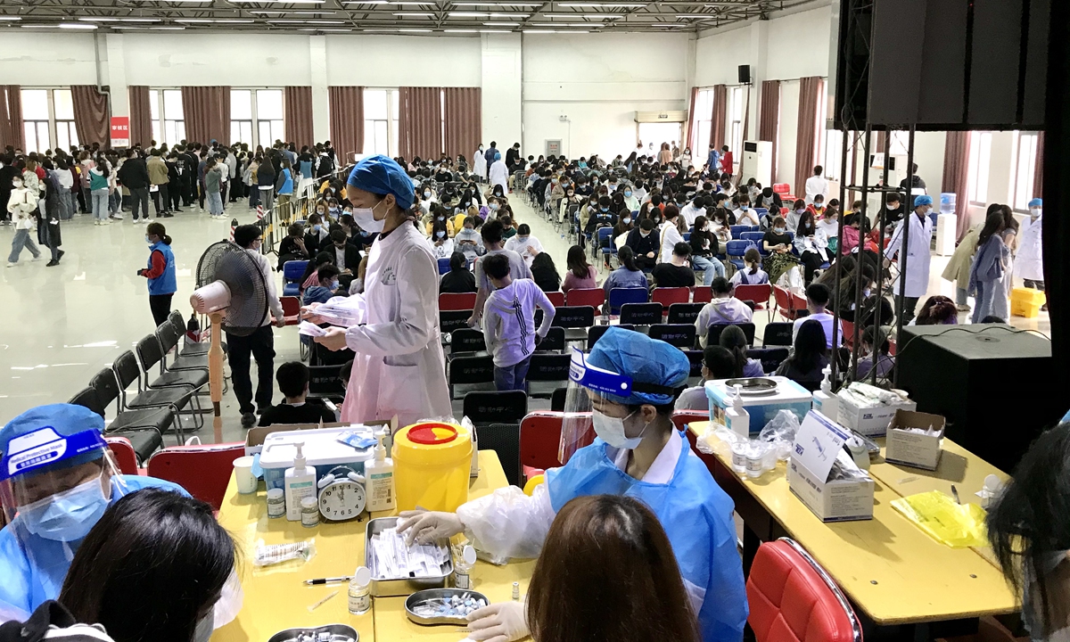 Residents in Wuhan, capital of Central China's Hubei Province, take COVID-19 vaccines on Tuesday at a local vaccination site. Hubei had administered more than 6.3 million doses to its residents as of Sunday, and it vowed to vaccinate all major areas and major groups. Wuhan itself has vowed to vaccinate all local residents aged 18 and above. Photo: VCG   