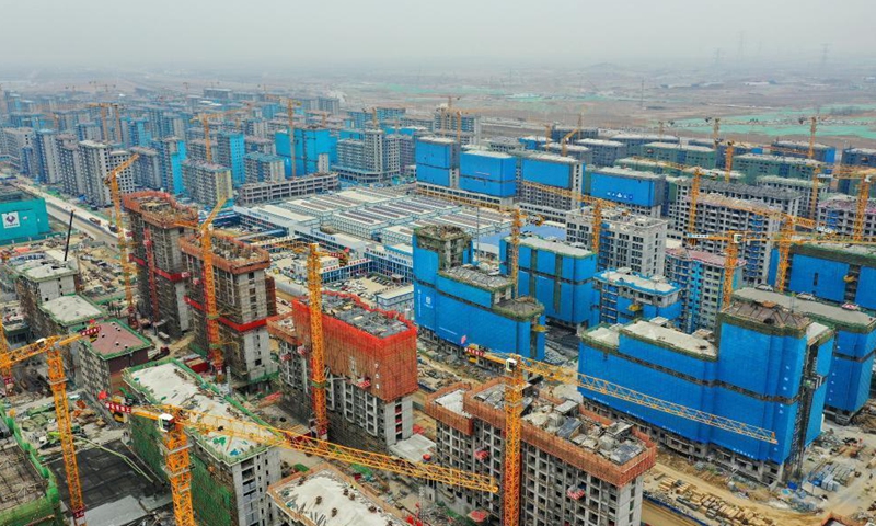 Aerial photo taken on March 18, 2021 shows the construction site of residential buildings in Rongdong area of Xiongan New Area, north China's Hebei Province. The Xiongan new area has begun its large-scale development and construction, with more than 100,000 constructors working on over 120 major projects in the area. The city of the future is greeting a brand new look day by day. Photo: Xinhua