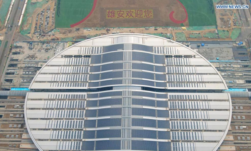 Aerial photo taken on March 19, 2021 shows the Xiongan Railway Station of the Beijing-Xiongan intercity railway in Xiongan New Area, north China's Hebei Province. The Xiongan new area has begun its large-scale development and construction, with more than 100,000 constructors working on over 120 major projects in the area. The city of the future is greeting a brand new look day by day. Photo: Xinhua