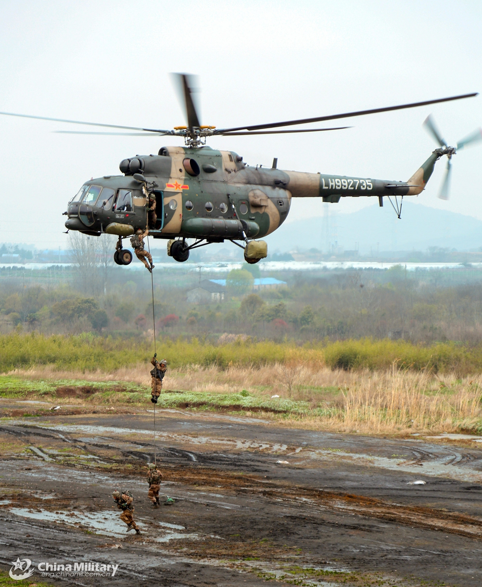 Soldiers assigned to an army aviation brigade under the PLA 72nd Group Army rappel from a transport helicopter during a fast-roping training exercise which aims to beef up the troops' coordinated operational capability on March 20, 2021.  Photo: China Military Online