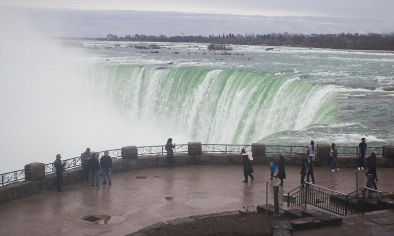 Visitors are seen at the Canadian side of Niagara Falls, Ontario, Canada, on March 31, 2021. Canada's tourism spending was cut 48.1 percent in 2020 and tourism gross domestic product (GDP) plunged 47.9 percent, Statistics Canada said Wednesday. Photo:Xinhua