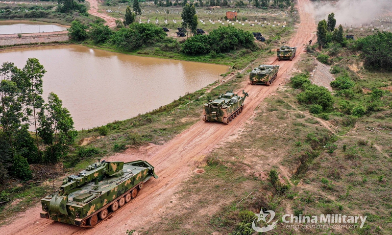 A group of engineering vehicles attached to an engineer element under the PLA 72nd Group Army march forward in hilly area during the breaching training on March 22, 2021.Photo:China Military