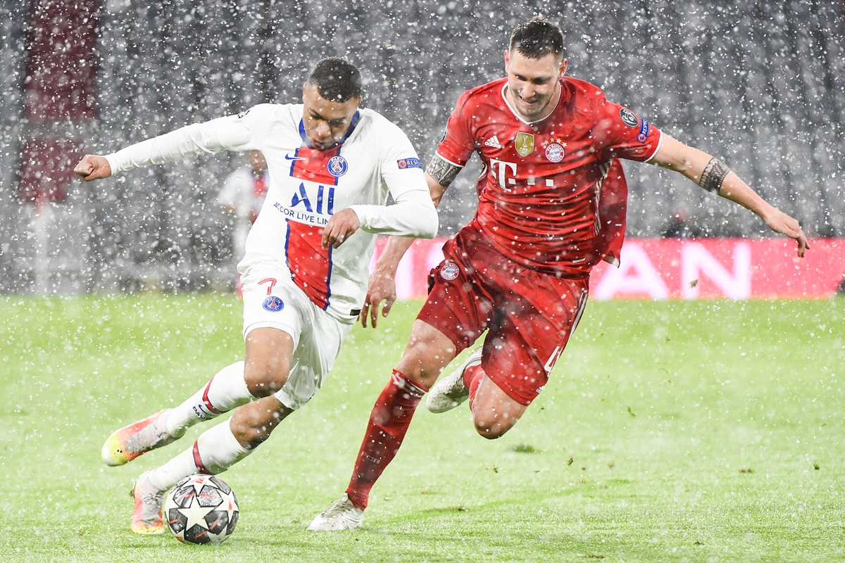 Kylian Mbappe (left) of Paris Saint-Germain and Niklas Sule of Bayern Munich compete for the ball during their UEFA Champions League quarterfinal first-leg match on Wednesday in Munich, Germany. Photo: VCG