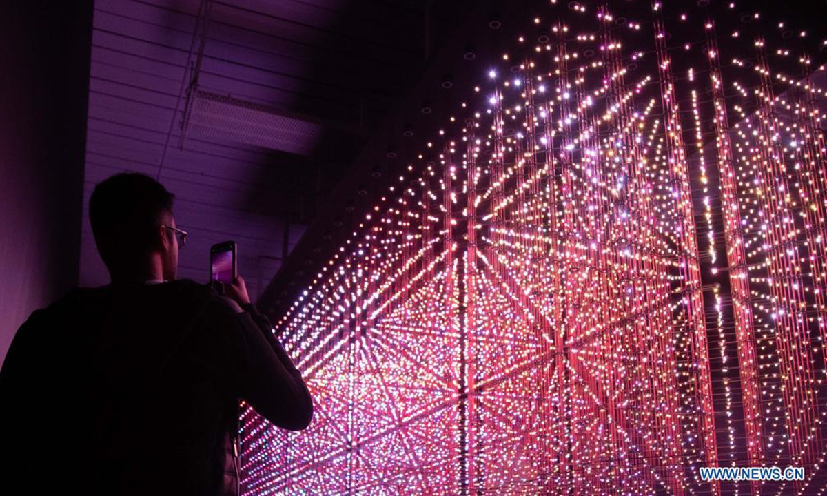 People visit the Lumen exhibition at a gallery in Chippendale, New South Wales, Australia, on April 18, 2021. (Photo by Hu Jingchen/Xinhua)