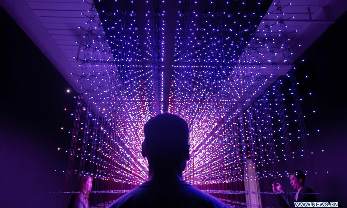 People visit the Lumen exhibition at a gallery in Chippendale, New South Wales, Australia, on April 18, 2021. (Photo by Hu Jingchen/Xinhua)