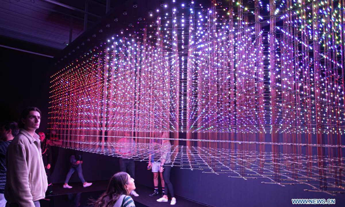 People visit the Lumen exhibition at a gallery in Chippendale, New South Wales, Australia, on April 18, 2021. (Photo by Hu Jingchen/Xinhua)