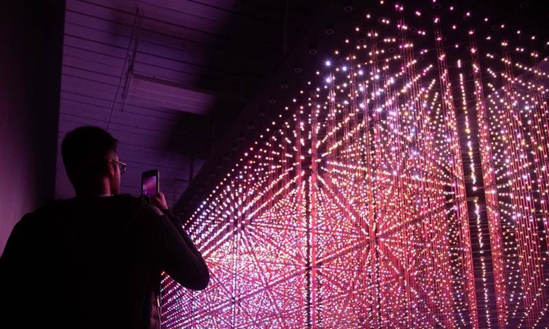 A man visits the Lumen exhibition at a gallery in Chippendale, New South Wales, Australia, on April 18, 2021.(Photo: Xinhua)