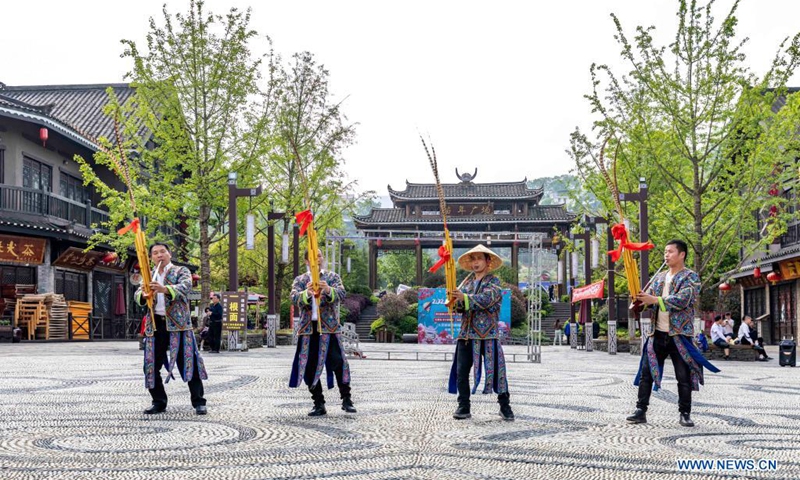 People perform traditional Chinese music and dance at the Danzhai Wanda Town in Danzhai County, Qiandongnan Miao and Dong Autonomous Prefecture, southwest China's Guizhou Province, April 21, 2021.(Photo: Xinhua)