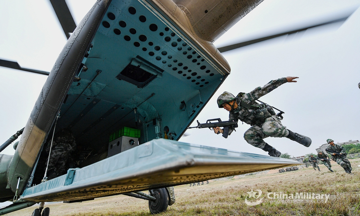 Soldiers assigned to a brigade of the PLA 73rd Group Army run to board a transport helicopter during an air assault landing training exerciseon April 14, 2021.Photo:China Military