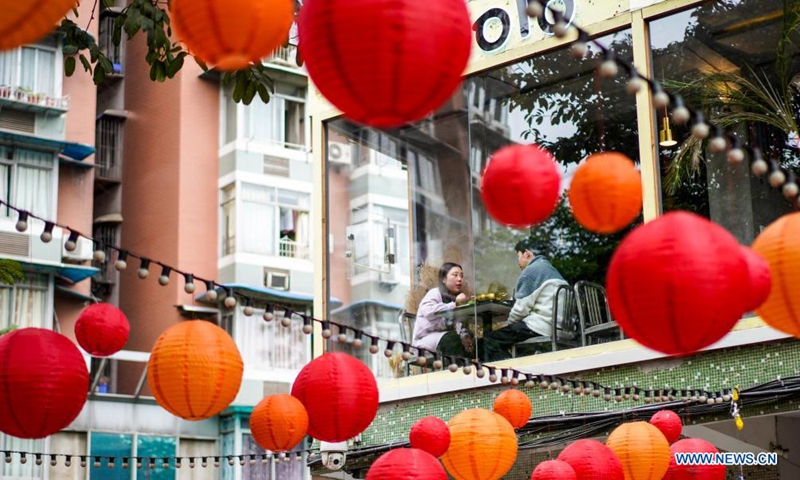 Tourists enjoy food at a restaurant in the Beicang Cultural & Creative Quarter, southwest China's Chongqing, April 22, 2021.Photo:Xinhua