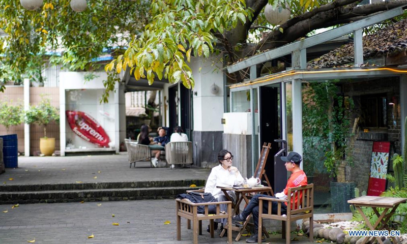 Tourists drink tea at a tea house in the Beicang Cultural & Creative Quarter, southwest China's Chongqing, April 22, 2021.Photo:Xinhua