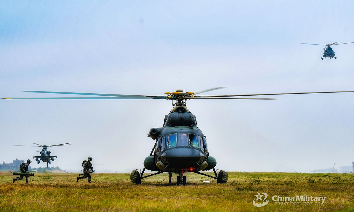 Soldiers assigned to a brigade of the PLA 73rd Group Army run to board a transport helicopter during an air assault landing training exerciseon April 14, 2021. Photo:China Military