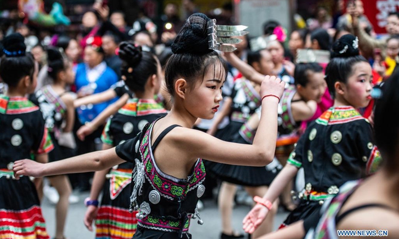 Girls of Miao ethnic group perform a traditional dance during a parade to celebrate the Miao Sisters Festival in Taijiang County, Qiandongnan Miao and Dong Autonomous Prefecture, southwest China's Guizhou Province, April 25, 2021. Recognized as a national intangible cultural heritage, the Miao Sisters Festival is celebrated annually around the 15th day of the third lunar month according to the lunar calendar in China.(Photo: Xinhua)