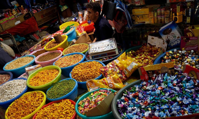 A man sells nuts and sweets ahead of Eid al-Fitr at a market in Sanaa, Yemen, on May 5, 2021. Eid al-Fitr marks the end of the fasting month of Ramadan.(Photo: Xinhua)