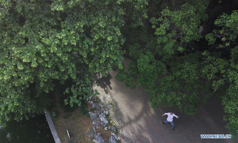 In this aerial photo, a man exercises in Huancheng Park in Hefei, capital of east China's Anhui Province, May 5, 2021.(Photo: Xinhua)