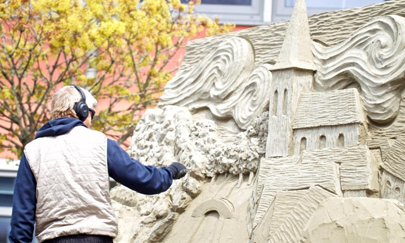 An artist works on a sand sculpture during the European Sand Sculpture Championships in Zandvoort, the Netherlands, May 6, 2021. The European Sand Sculpture Championship is staged in Zandvoort for the tenth time.Photo:Xinhua