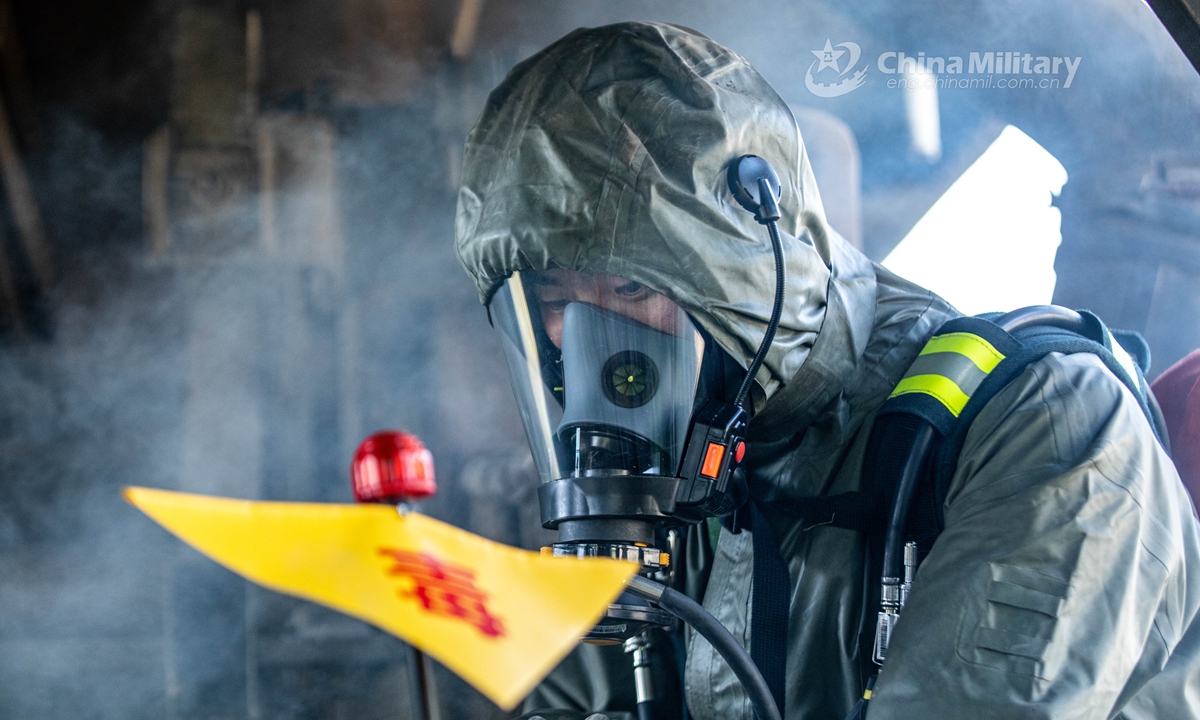 Armed policemen in Mission-Oriented Protective Posture (MOPP) gears use the chemical agent detector to locate the simulated toxic agents for sampling analysis in the railway ballast. A chemical defense element under the Chinese People’s Armed Police (PAP) Force Tianjin Contingent conducted an emergency training exercise on April 28, 2021.Photo: China Military Online