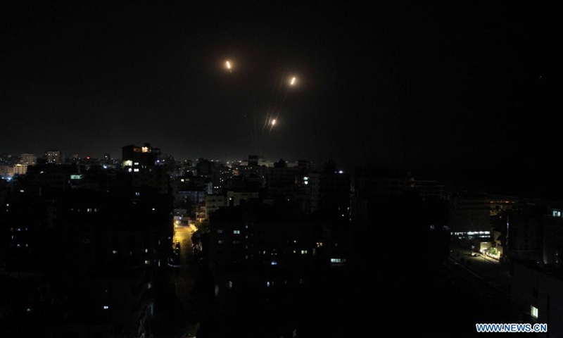 Photo taken on May 11, 2021 shows explosions following Israeli air strikes in Gaza City. Israeli military chief Aviv Kochavi decided on Tuesday to extend Israel's offensive in the Gaza Strip with no time limit amid the tensions with Hamas, a Palestinian movement that runs the strip. Three women in Israel and 28 people in Gaza Strip have been reportedly killed since Monday in the worst flare-up of Israeli-Palestinian violence since Israel's major military assault in Gaza in 2014.(Photo: Xinhua)