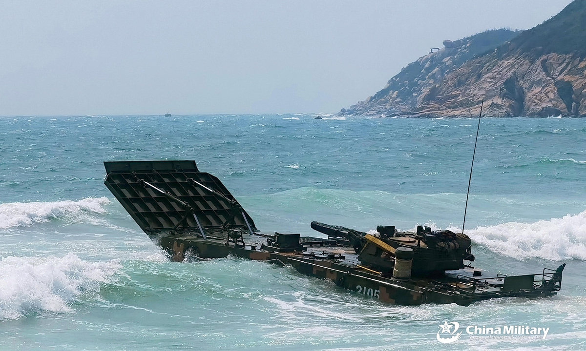 An amphibious armored infantry fighting vehicle (IFV) attached to a brigade under the PLA 72nd Group Army makes its way into the sea during IFV driving training in late April, 2021. Photo:China Military