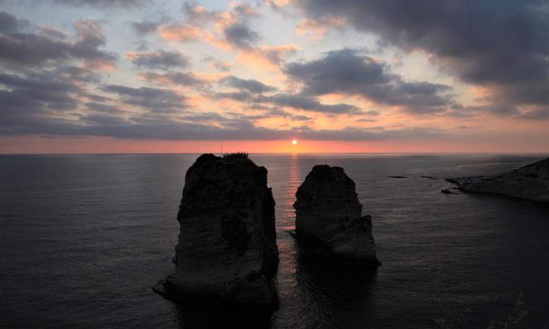 Sunset is seen at Raouche Rocks in Beirut, Lebanon, on May 13, 2021.Photo:Xinhua