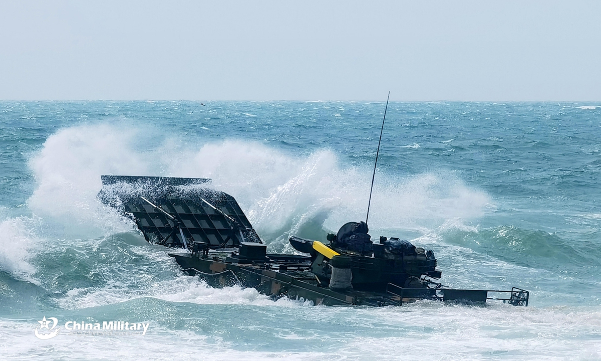 An amphibious armored infantry fighting vehicle (IFV) attached to a brigade under the PLA 72nd Group Army makes its way into the sea during IFV driving training in late April, 2021. Photo:China Military