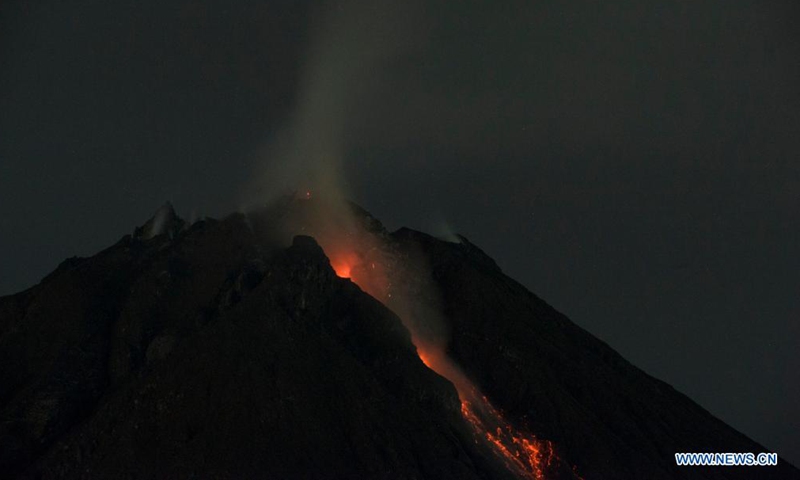 Volcanic materials spew from Mount Sinabung as seen from Karo district, North Sumatra, Indonesia, May 13, 2021.Photo:Xinhua