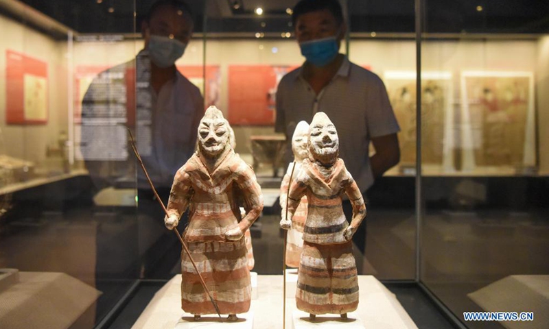 Visitors watch exhibits at the Turpan Museum, Turpan, northwest China's Xinjiang Uygur Autonomous Region, May 13, 2021. More and more tourists choose to visit Turpan, a city noted for its splendid historical culture. The Turpan Museum, home to a collection of more than 20,000 relics, has become an emerging tourist attraction for the city.Photo:Xinhua