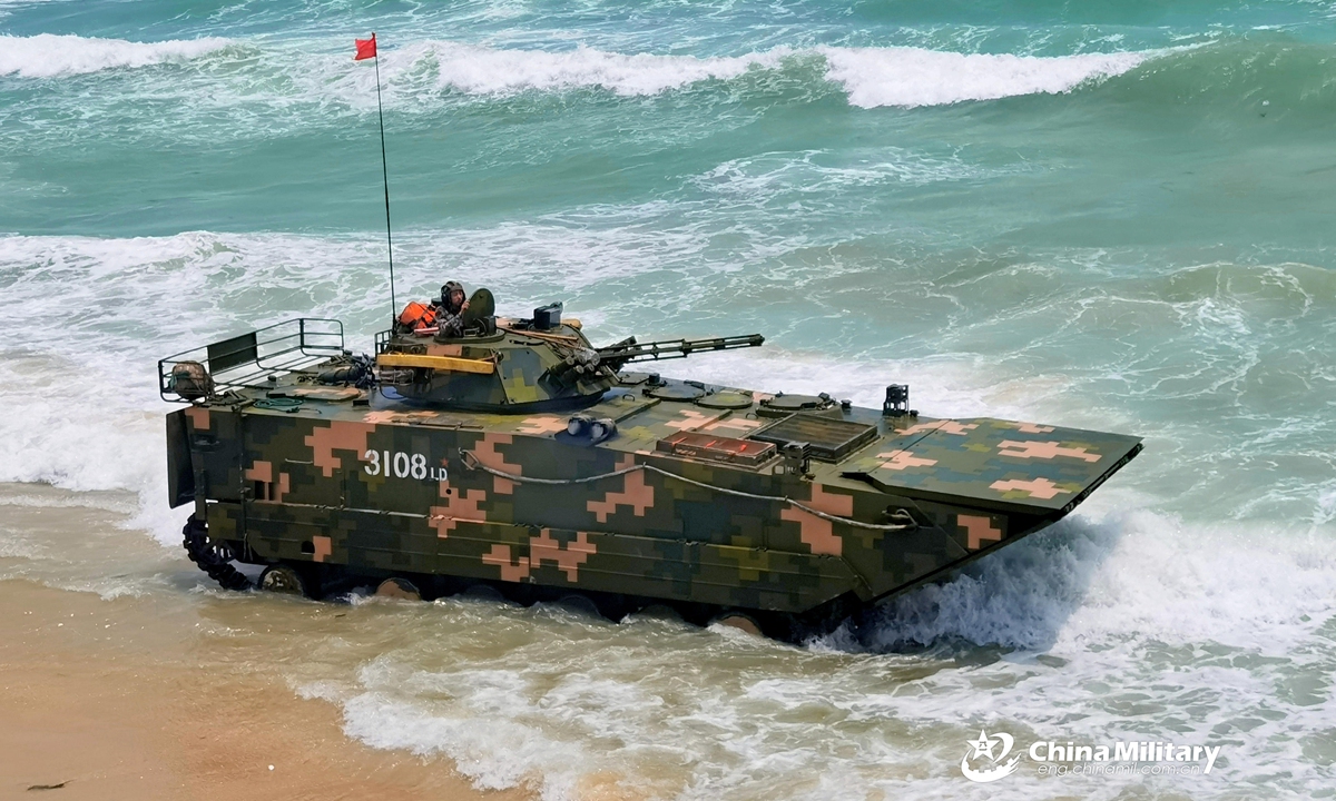 An amphibious armored infantry fighting vehicle (IFV) attached to a brigade under the PLA 72nd Group Army makes its way into the sea during IFV driving training in late April, 2021. Photo:China Military