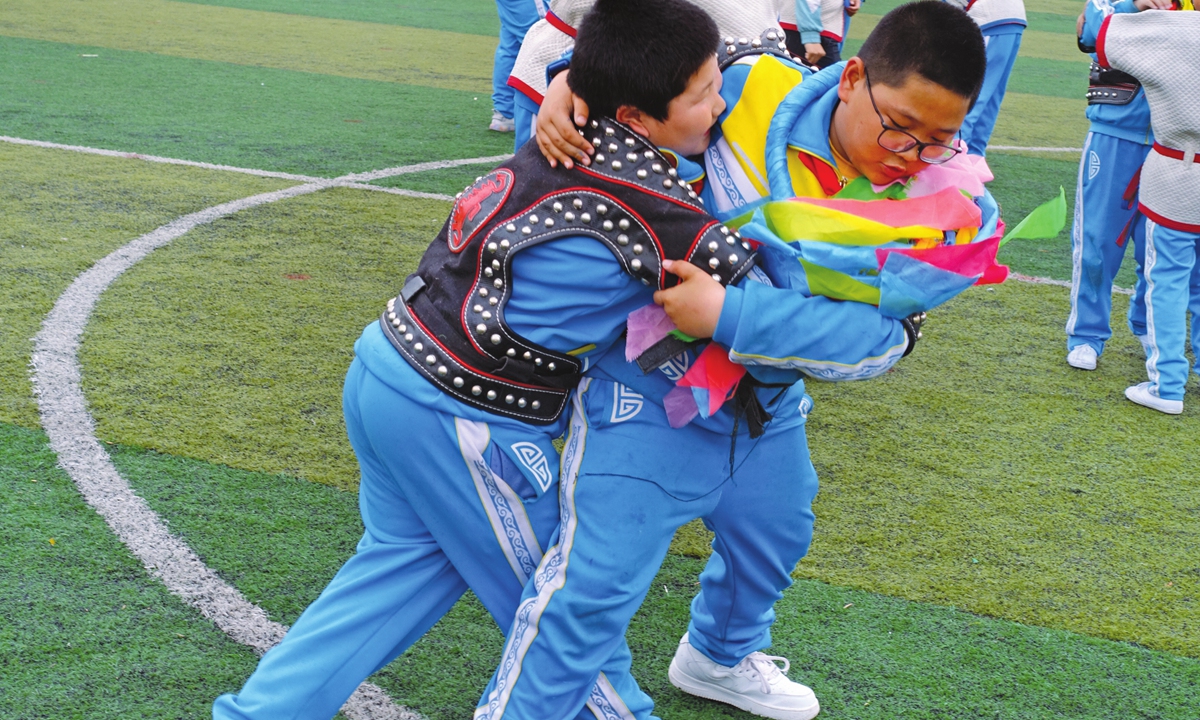 Daichin (right) competes with his classmate during a wrestling class on Friday. Photo: Lin Xiaoyi/GT