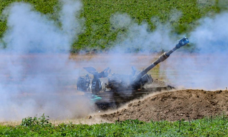 Israeli army artillery corps fire towards Gaza near the Israel-Gaza border near southern Israeli city of Sderot on May 16, 2021.(Photo: Xinhua)