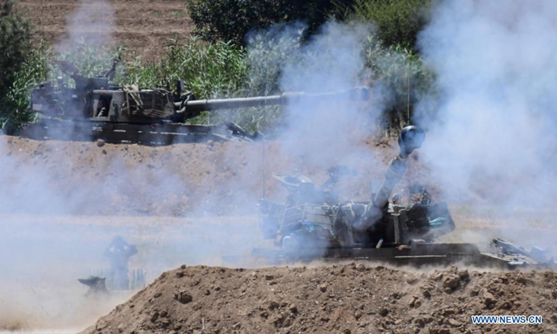 Israeli army artillery corps fire towards Gaza near the Israel-Gaza border near southern Israeli city of Sderot on May 16, 2021.(Photo: Xinhua)