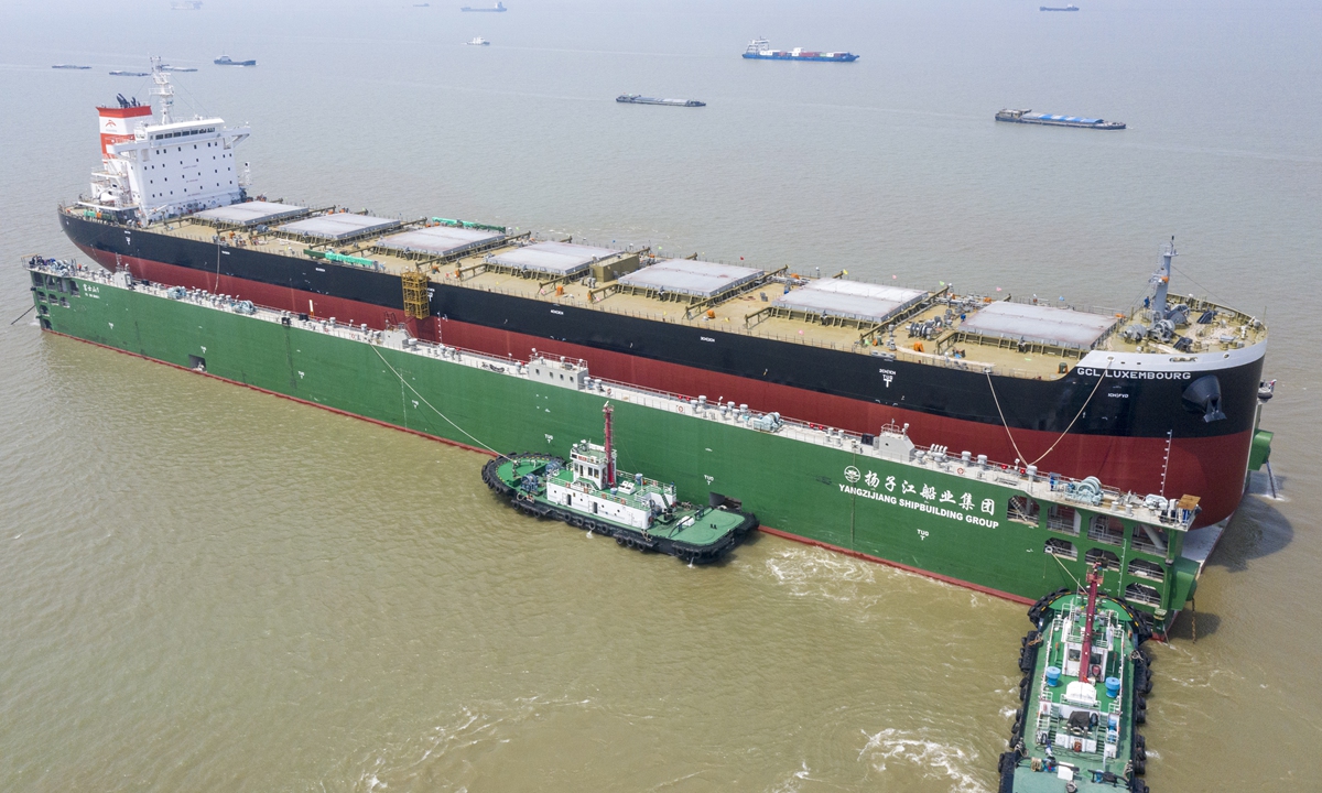 An 80,000-ton bulk cargo vessel is launched into the Yangtze River on Monday from Taicang, East China's Jiangsu Province. The shipyard plans to build 11 cargo ships with a total displacement of some 1 million tons in 2021. Photo: VCG 