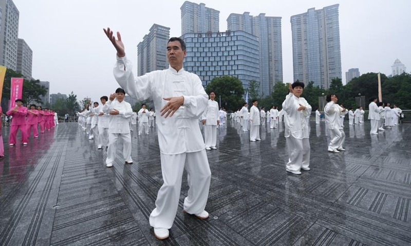 Senior hobbyists of Taijiquan, a traditional Chinese martial art, demonstrate Taijiquan moves by Fuchunjiang River in Tonglu County, east China's Zhejiang Province, on May 19, 2021. A nation-wide campaign to promote and demonstrate Taijiquan as a fitness exercise among senior citizens was launched here on Wednesday. More than 2,000 Taijiquan hobbyists from all over the country flocked in to participate in the demonstrations and performances.(Photo: Xinhua)