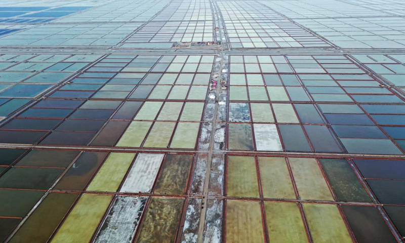 Aerial photo taken on May 18, 2021 shows the salt ponds at Binhai Township, Zhanhua District, Binzhou City of east China's Shandong Province. Workers have started harvesting spring salt from the 600,000-mu (40,000 hectares) of salt fields at Binhai Township. The total output is expected to hit 500,000 tons when the harvest work concludes by the end of June.Photo:Xinhua