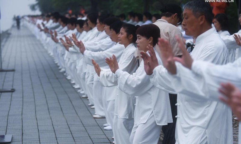 Senior hobbyists of Taijiquan, a traditional Chinese martial art, demonstrate Taijiquan moves by Fuchunjiang River in Tonglu County, east China's Zhejiang Province, on May 19, 2021. A nation-wide campaign to promote and demonstrate Taijiquan as a fitness exercise among senior citizens was launched here on Wednesday. More than 2,000 Taijiquan hobbyists from all over the country flocked in to participate in the demonstrations and performances.(Photo: Xinhua)