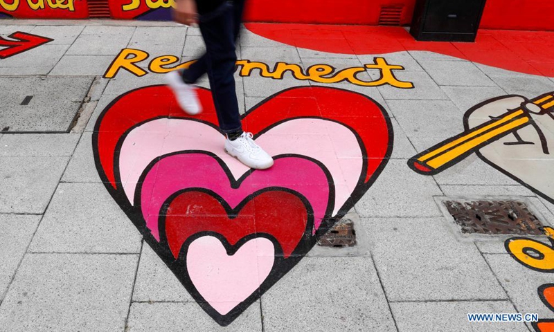 Photo taken on May 26, 2021 shows the artwork He(art) is Everywhere near Tate Modern in London, Britain. New artworks of the project Beyond Boundaries unveiled near Tate Modern. The artworks are aimed at reconnecting people with each other. (Xinhua/Han Yan)