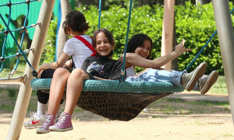 Children play at a park in Istanbul, Turkey, May 25, 2021. (Xinhua/Xu Suhui)