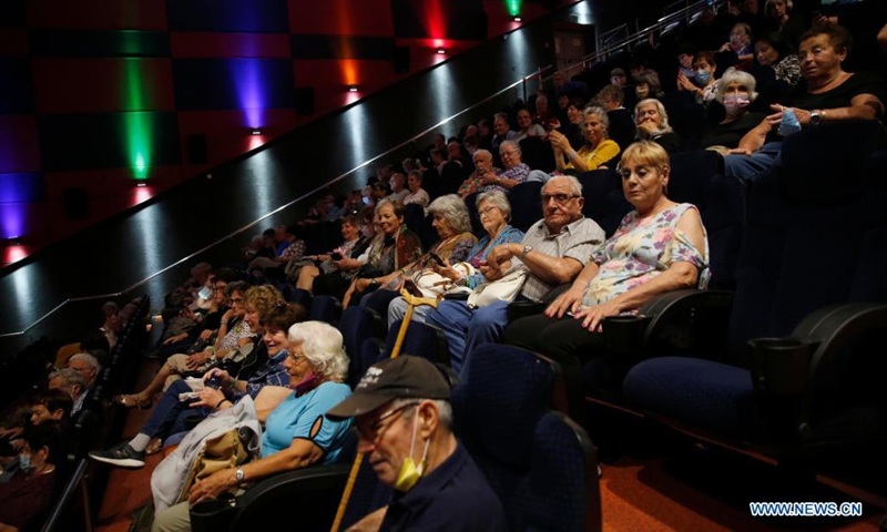 People are seen in a reopened cinema in central Israeli city of Rishon Lezion on May 26, 2021. After months of closure amid COVID-19 pandemic, Israel's movie theaters start to reopen this week. (Photo by Gil Cohen Magen/Xinhua)