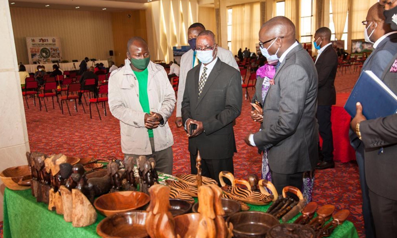 Zambian government officials visit an exhibition at the launch of the Africa Day theme rollout in Lusaka, Zambia, May 26, 2021. Zambia on Wednesday launched the rollout exercise of promoting the 2021 Africa Day commemoration. The theme for this year's commemoration is Arts, Culture and Heritage: Levers for Building the Africa We Want. (Photo by Martin Mbangweta/Xinhua)